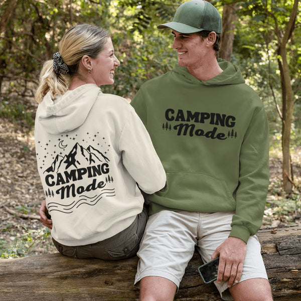 Introducing our gender-neutral hoodie, perfect for outdoor enthusiasts and camping lovers! Featuring a fun camping graphic on the back and the phrase "Camping Mode" on the front, this hoodie is both stylish and comfortable.